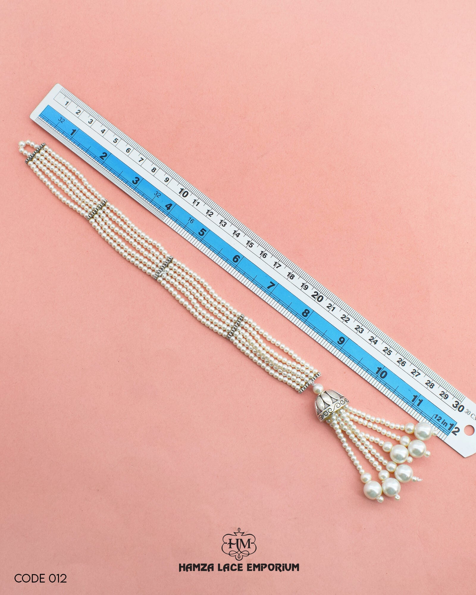 The size of the 'Button Patti 012' is showcased alongside a helpful ruler to visualize and assess the product size accurately.