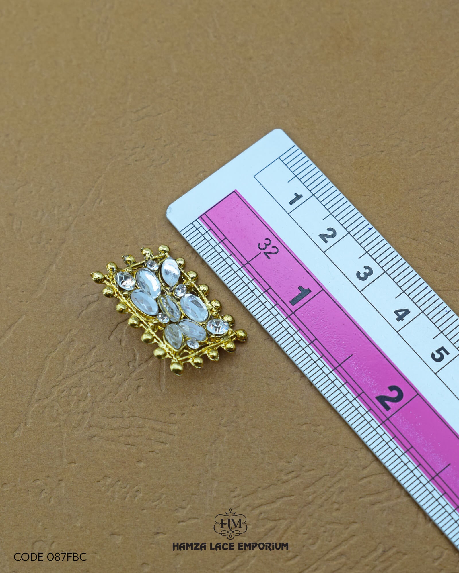 The size of the 'Fancy Button FBC087' is indicated using a ruler.