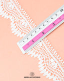 A ruler is on the 'Edging Scallop Lace'  and measuring its size which is two inches.