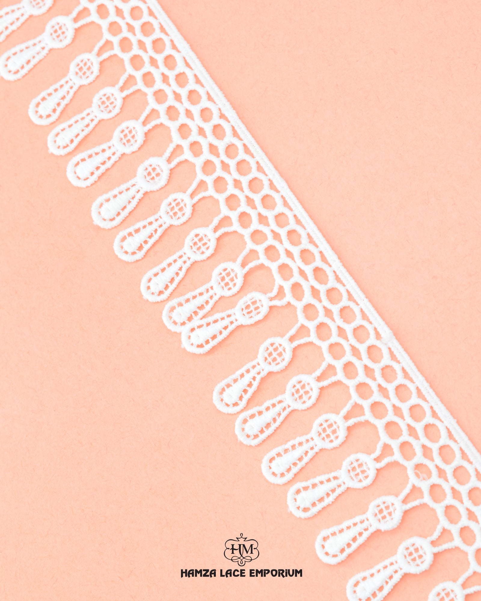 The white color 'Edging Jhaalar Lace' is displayed on a pink color piece of cloth