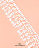 The white color 'Edging Jhaalar Lace' is displayed on a pink color piece of cloth
