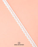 Zoomed view of the 'Edging Lace 17578' on a pink piece of the cloth having ' Hamza lace' written at the bottom