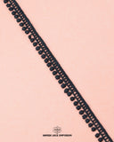 One black piece of the 'Edging Ball Lace 21660'
