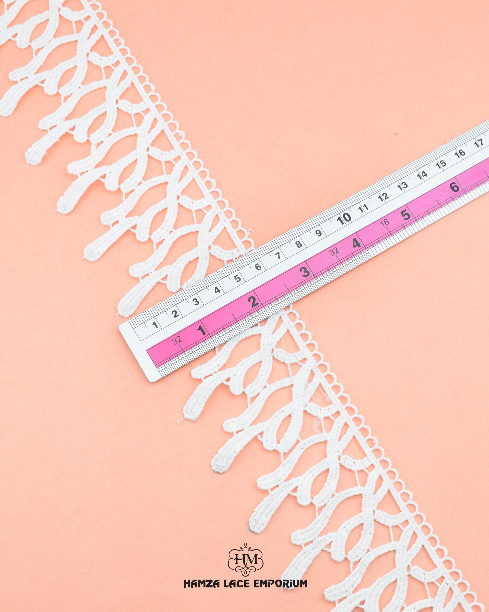 A scale is placed on the 'Edging Lace 21717' for the purpose to show its size that is 2.5 inches