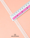 A scale is placed on the 'Center Filling Lace 22541' for the purpose to show its size that is 2.5 inches