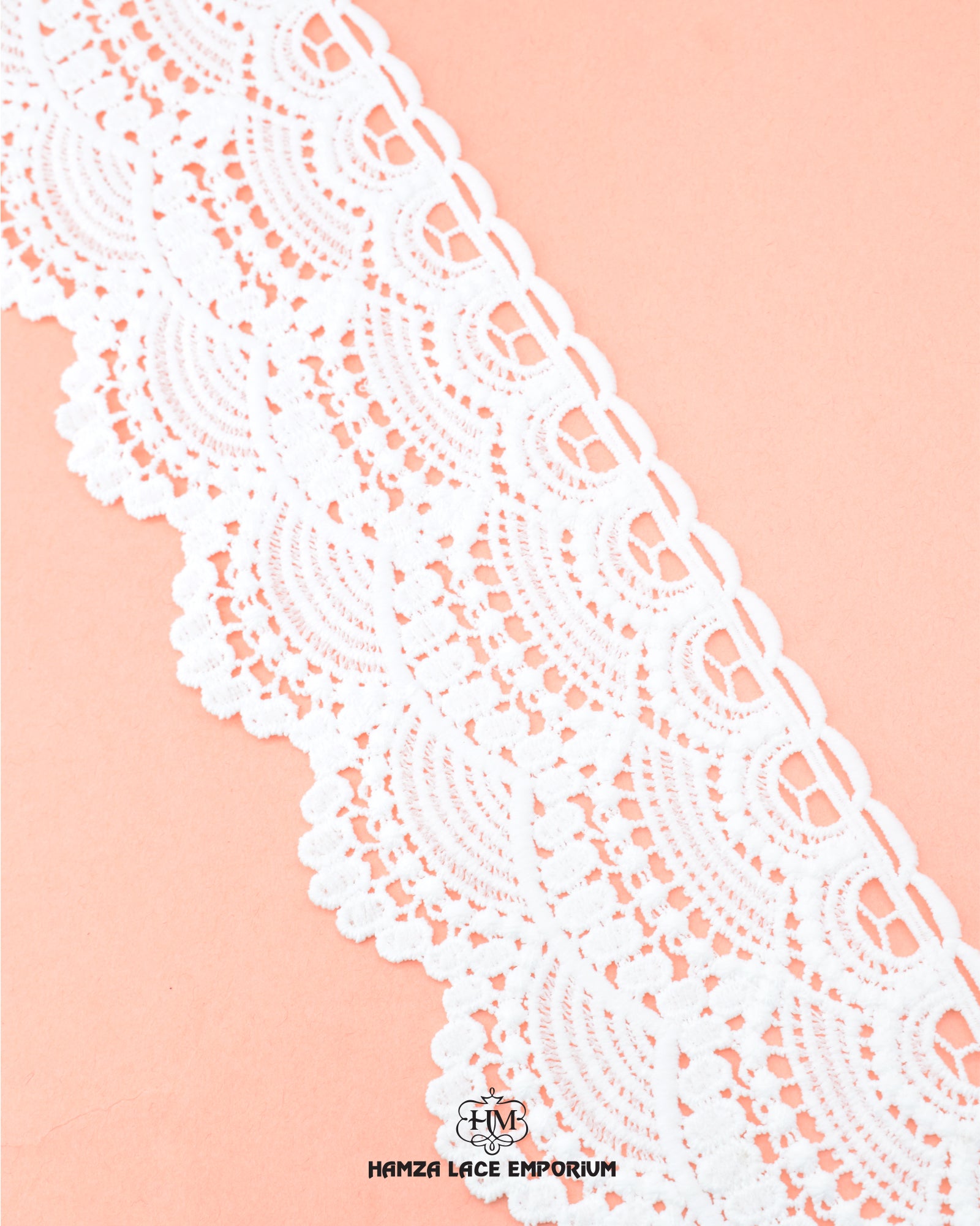 The White color 'Edging Scallop Lace 23370' is displayed on a pink piece of cloth having the brand name 'Hamza Lace' and the brand logo at the bottom