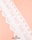 The White color 'Edging Scallop Lace 23370' is displayed on a pink piece of cloth having the brand name 'Hamza Lace' and the brand logo at the bottom