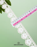 A ruler is measuring the size of the 'Edging Flower Lace 23382' as 1.5 inches