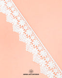 A piece of the white 'Edging Flower Lace 23392' is on the pink cloth and the brand name 'Hamza lace' at the bottom written in black color