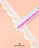 A scale is on the 'Edging Scallop Lace 23487' measuring its size as 1.25 inches
