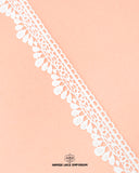The white color 'Edging Scallop Lace 23487' is on a pink piece of cloth with the brand name 'Hamza Lace' written at the bottom
