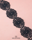 A black piece of the 'Center Filling Lace 23611' on a pink background and the 'Hamza Lace' sign and logo at the bottom is written with black color color