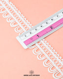 A Scale is measuring the size of the 'Edging Loop Lace 4312' as 1.25 inches