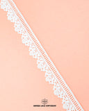 The White color 'Edging Flower Lace 4529' is displayed on a pink piece of cloth