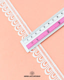 A scale is placed on the 'Edging Lace 21717' for the purpose to show its size that is 1 inch