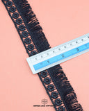 A measuring Scale is on the 'Edging Jhalar Lace 21446' showing Its size as 1.5 inches