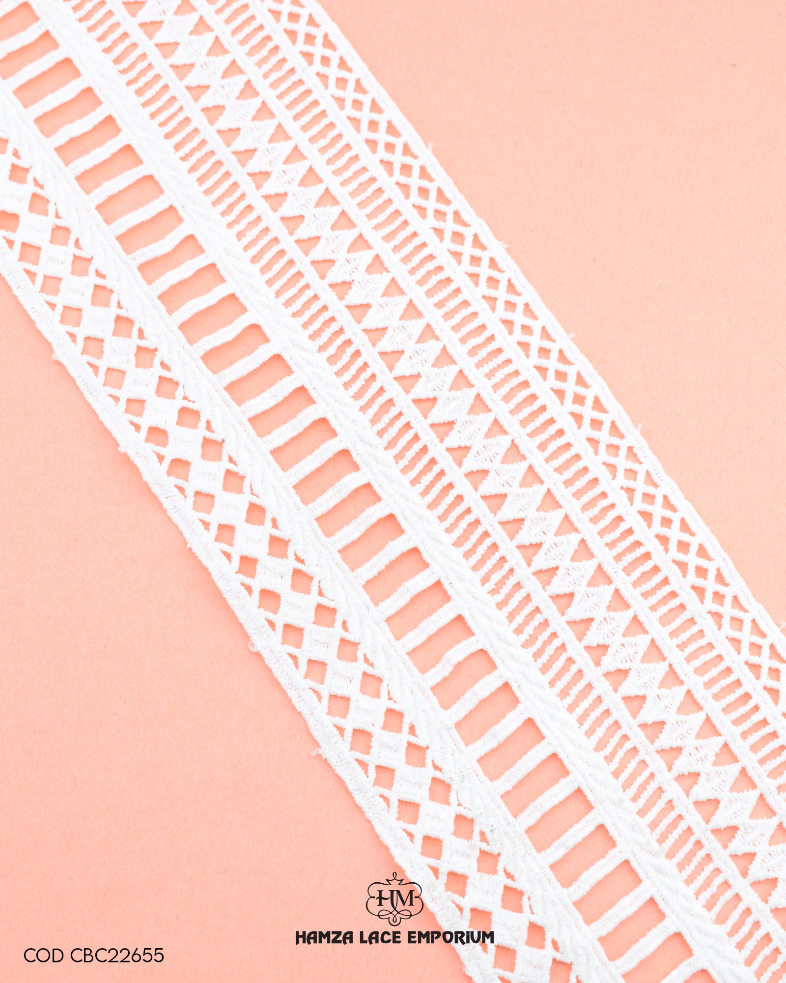 A white piece of the 'Center Filling Lace 22656' on a pink background and the 'Hamza Lace' sign and logo at the bottom is written with black color color