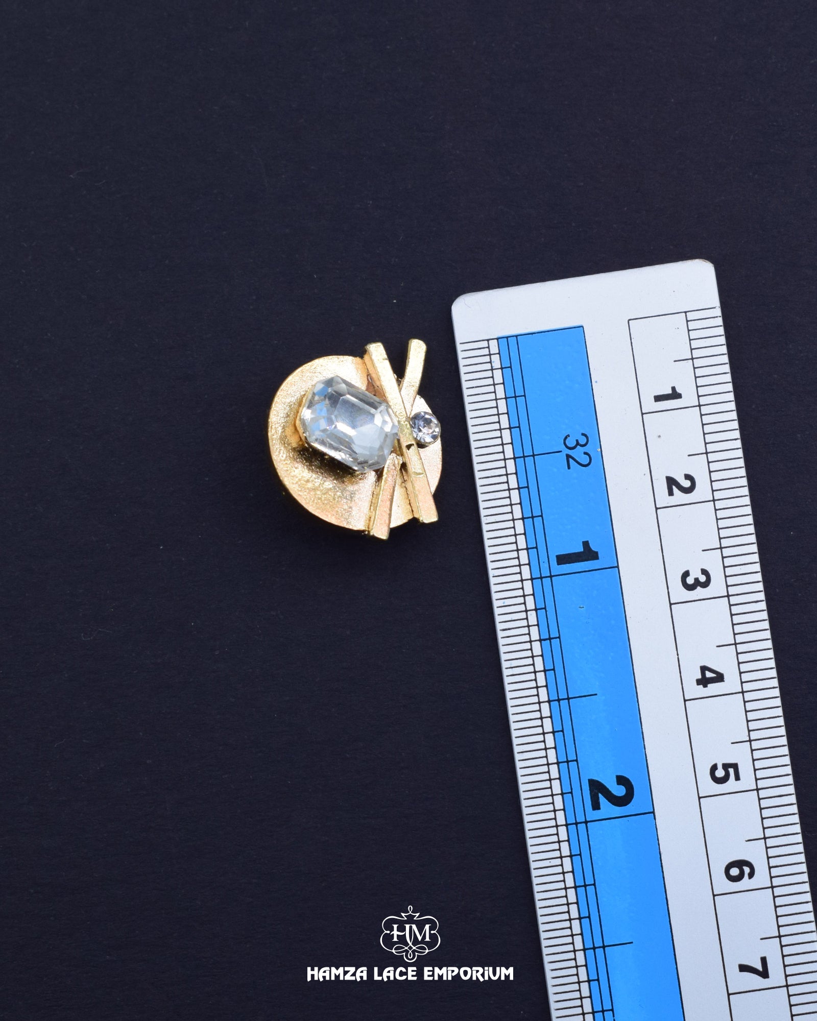 'Fancy Button FBC011' with a ruler placed alongside it to showcase the size.