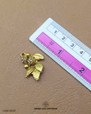 The 'Leaf Design Fancy Button 87FBC' size is showcased using a ruler for precise measurement.