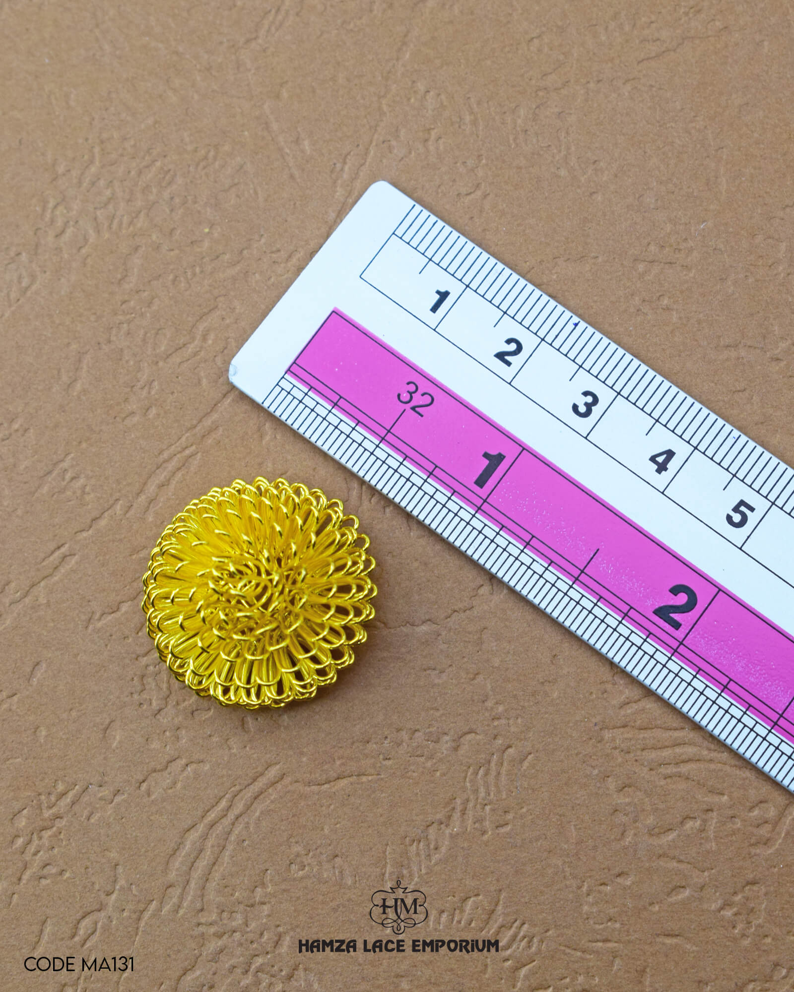 The 'Flower Design Metal Accessory MA131' size is showcased using a ruler for precise measurement.