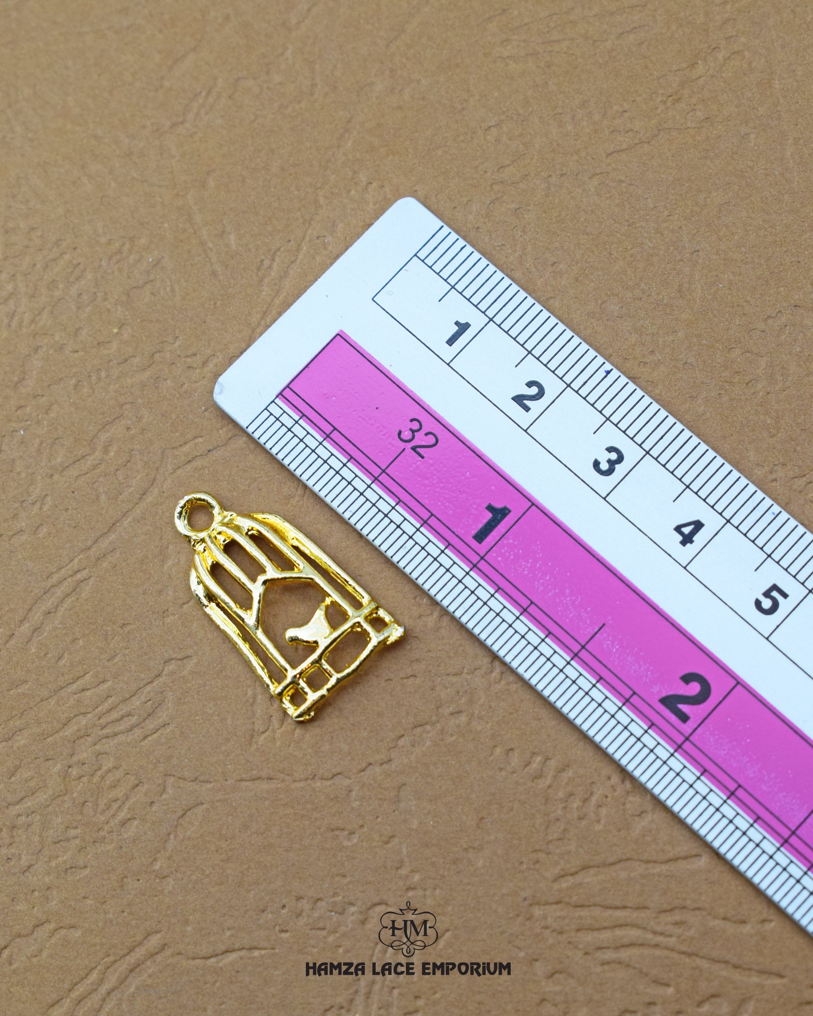 The size of the 'Cage Design Button MA183' is indicated using a ruler.