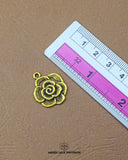 The size of the 'Flower Design Metal Button MA274' is showcased alongside a helpful ruler to visualize and assess the product size accurately.