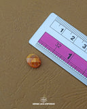 The size of the Beautifully designed 'Loop Shape Plastic Button MA379' is measured by using a ruler