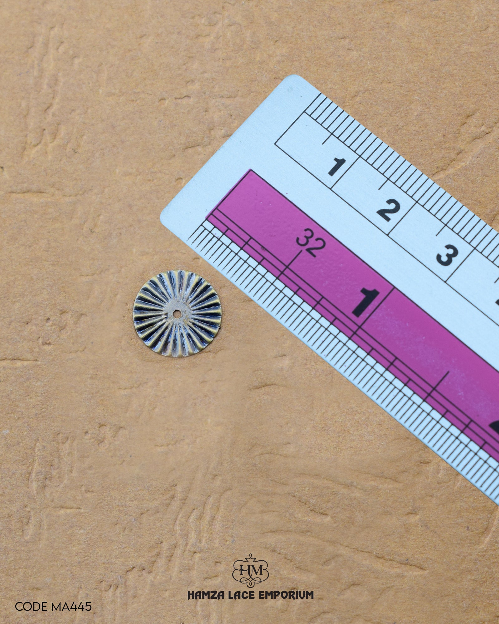 The size of the Beautifully designed 'Round Shape Button MA445' is measured by using a ruler