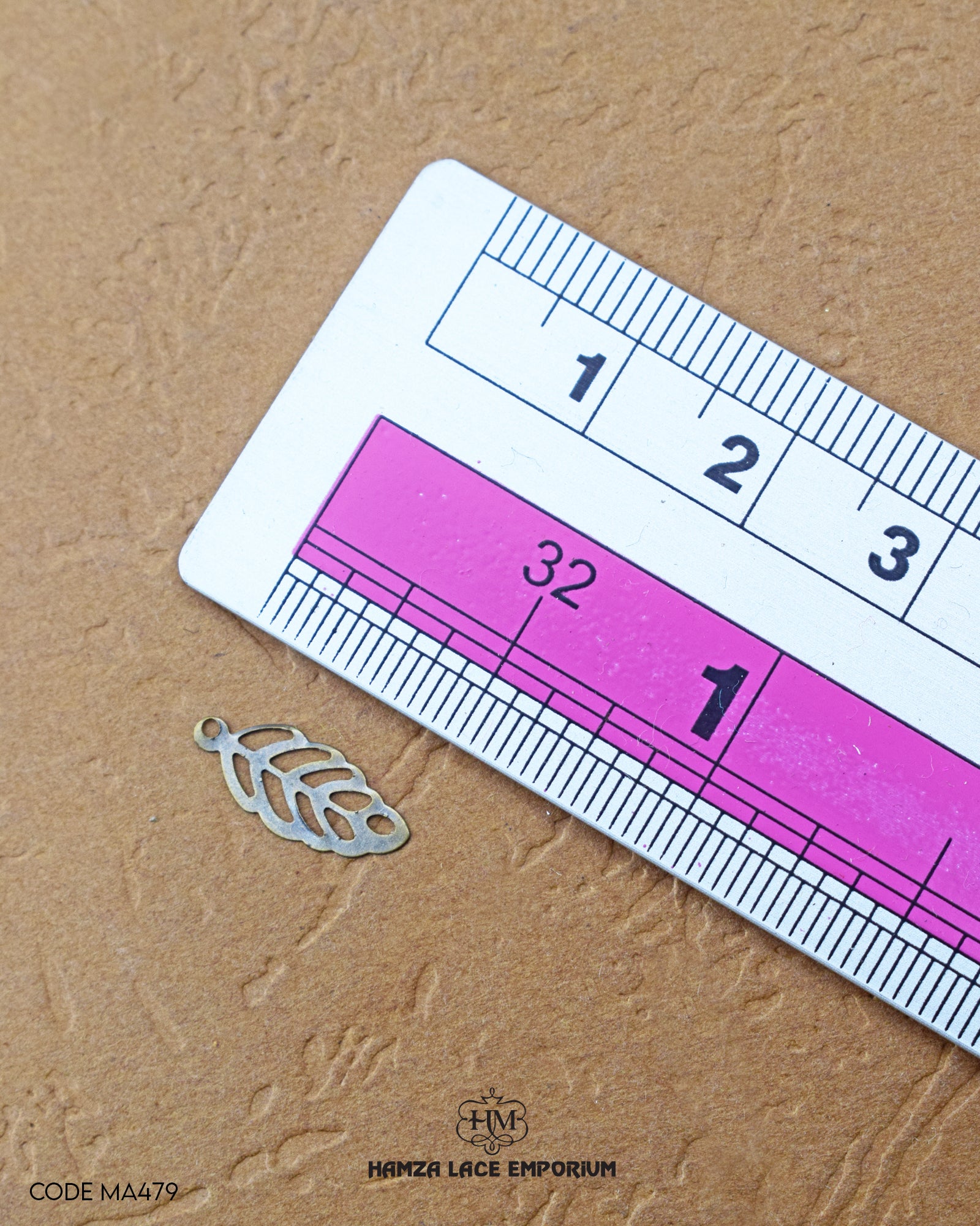 The size of the Beautifully designed 'Leaf Design Accessory MA479' is measured by using a ruler
