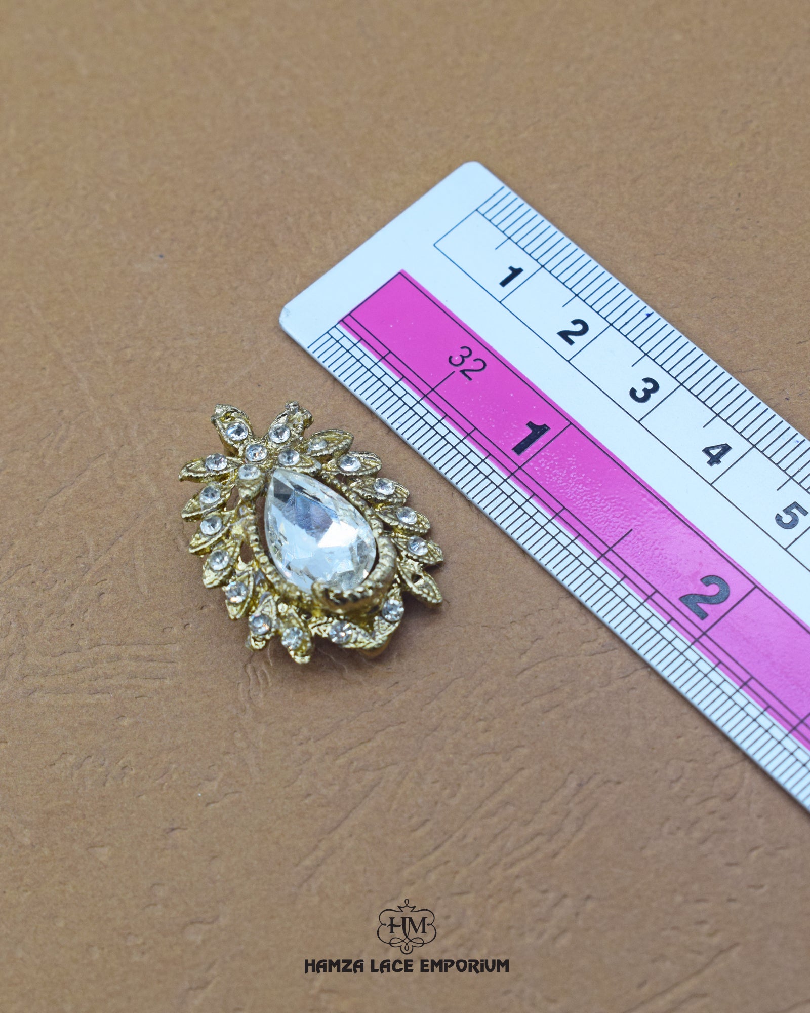 The size of the 'Kundan Stone Button MA585' is indicated using a ruler.