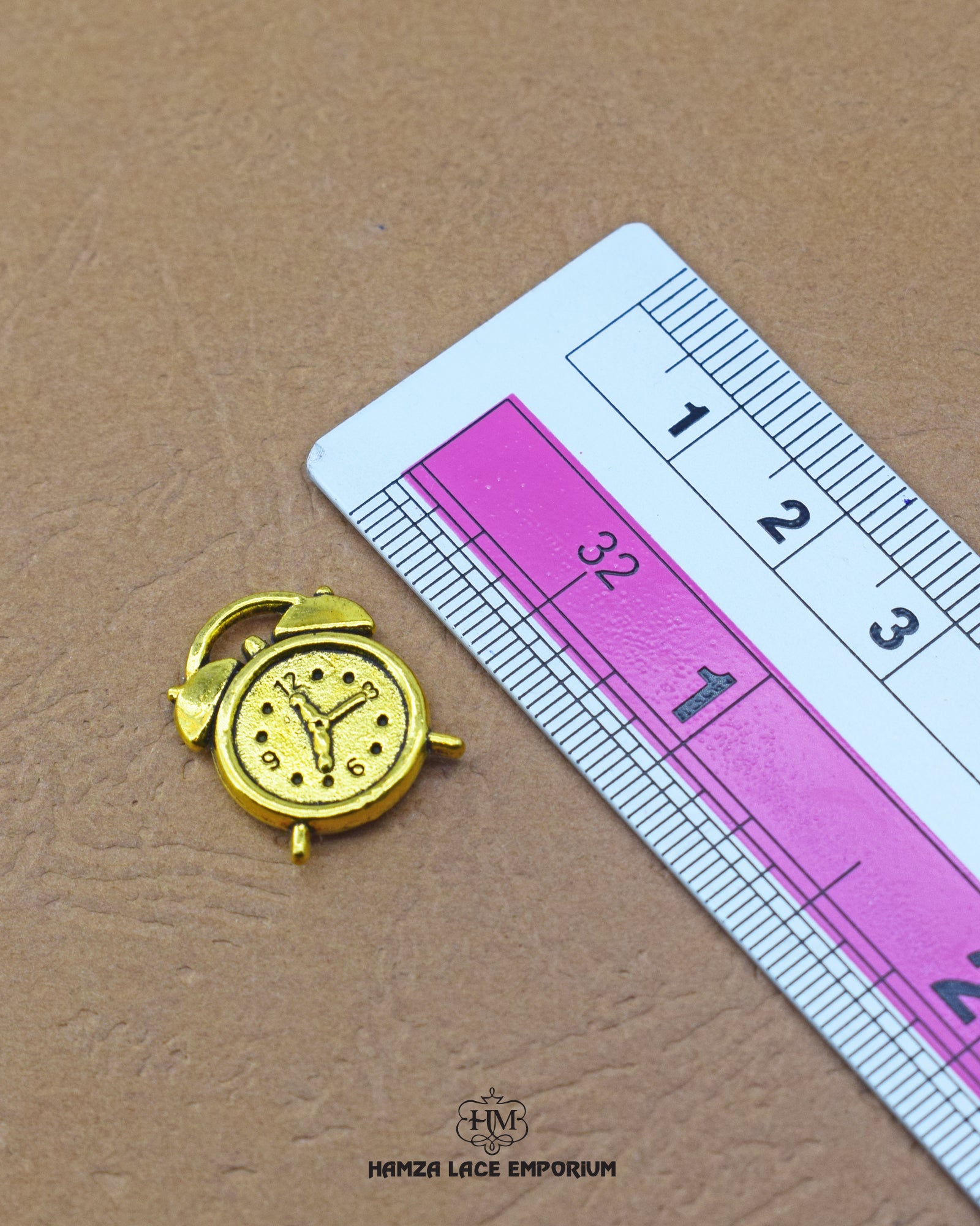 The size of the 'Clock Design Metal Button MA668' is indicated using a ruler.