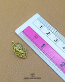 The 'Leaf Design Metal Button MA674' size is showcased using a ruler for precise measurement.