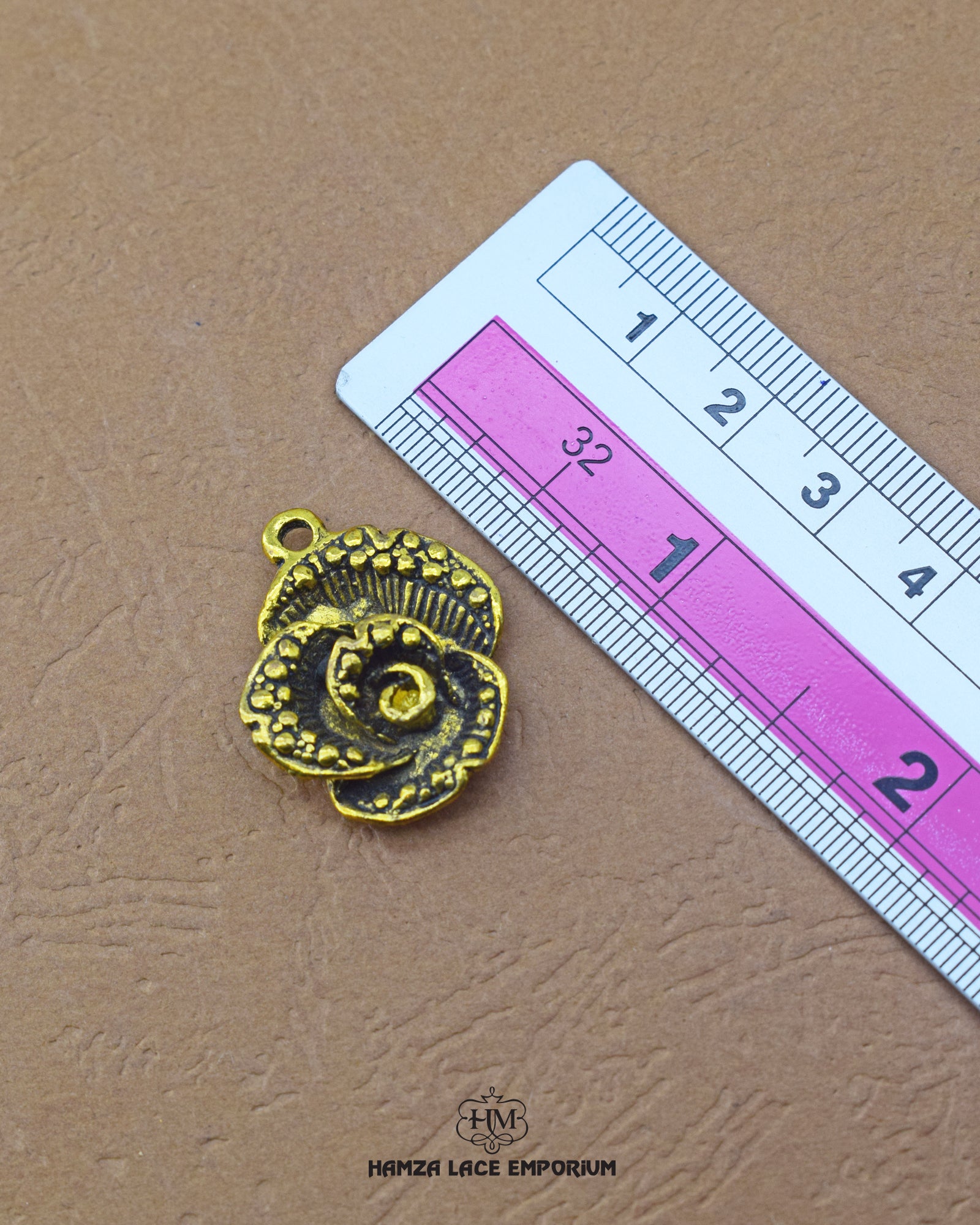 The 'Flower Design Metal Button MA681' size is showcased using a ruler for precise measurement.