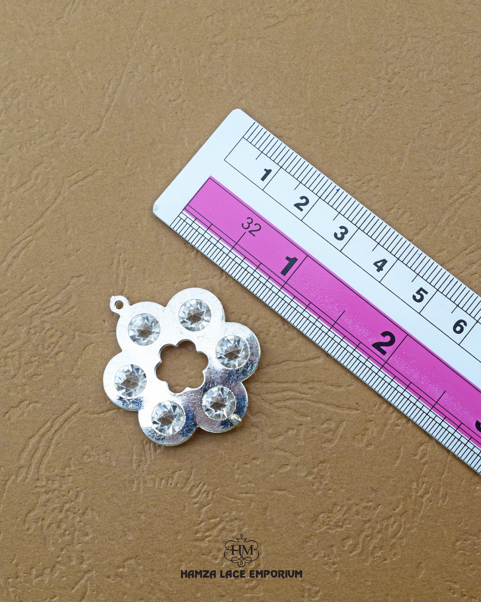 The size of the 'Flower Design Metal Accessory MA97' is showcased alongside a helpful ruler to visualize and assess the product size accurately.