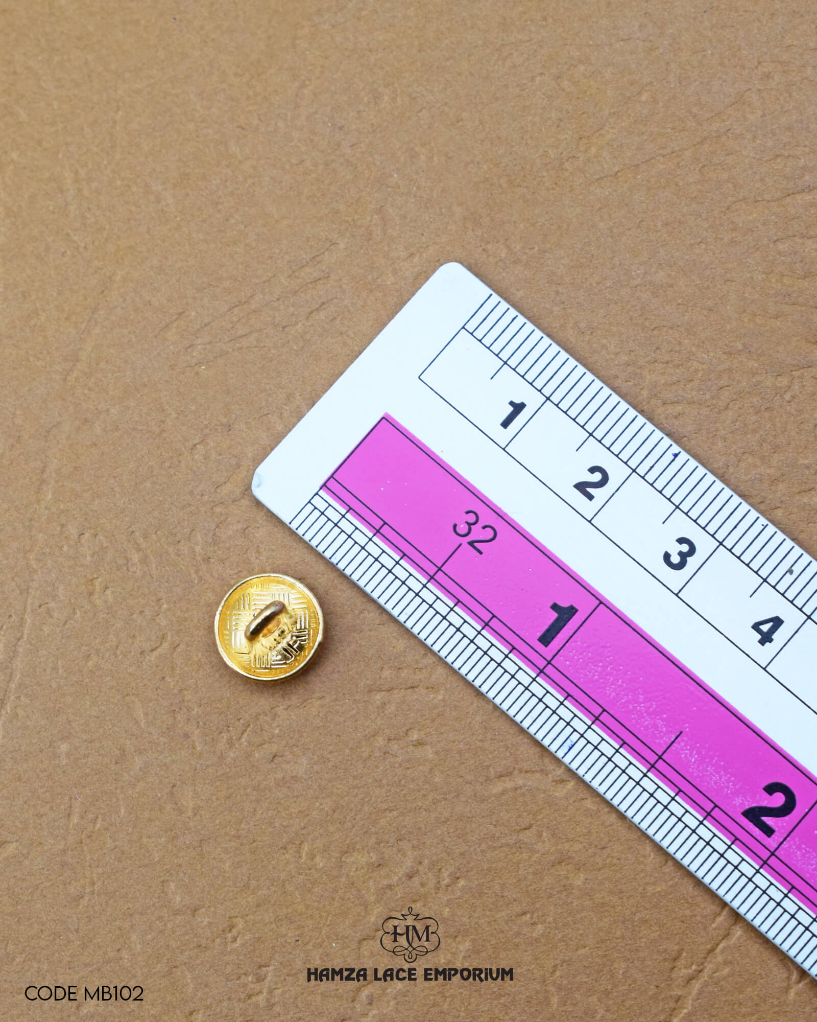 Size of the 'Metal Suiting Button MB102' is given with the help of a ruler