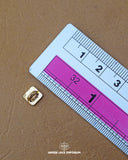 The size of the 'Golden Metal Button MB128' is measured using a ruler.