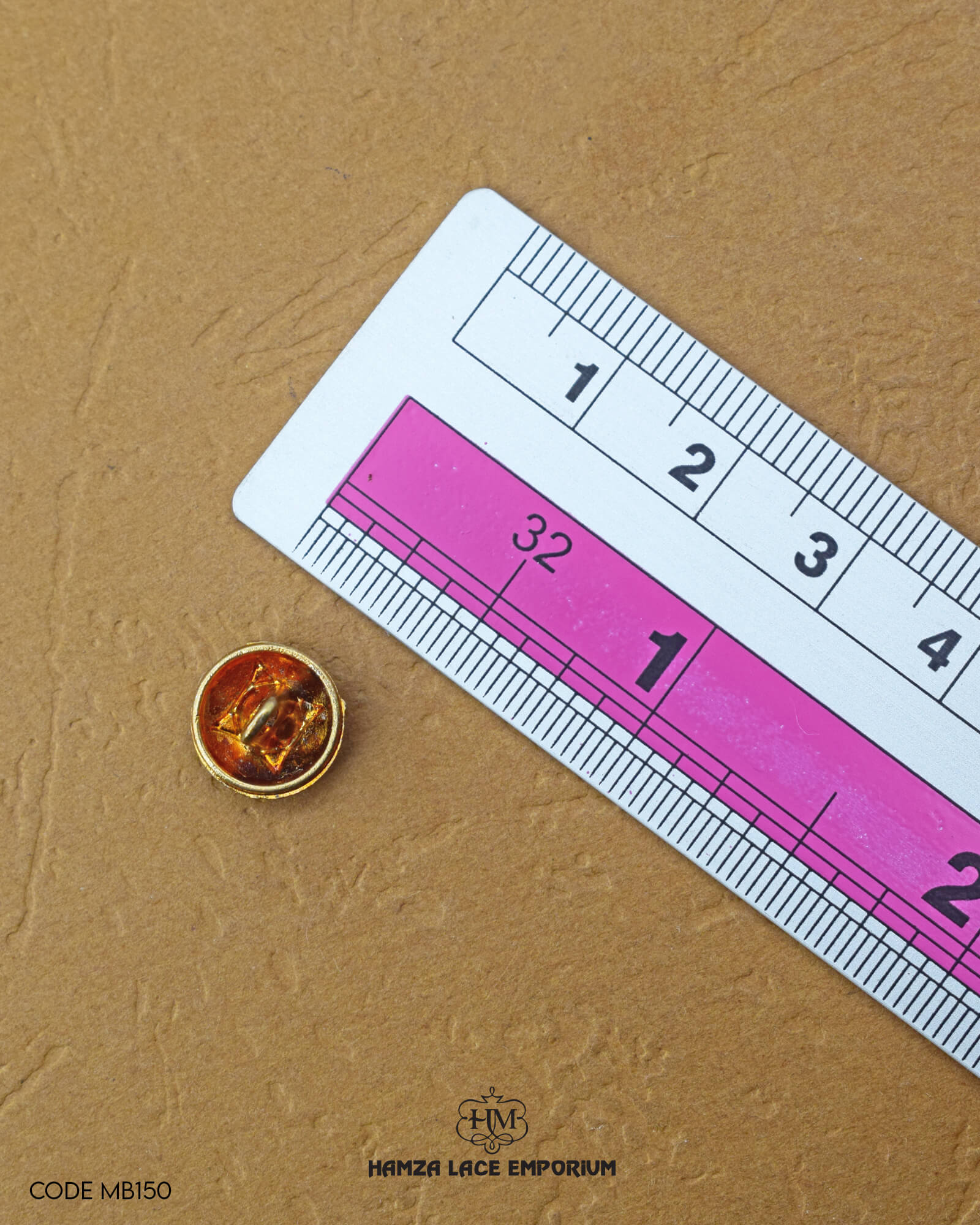 The size of the 'Metal Button MB150' is measured by using a ruler