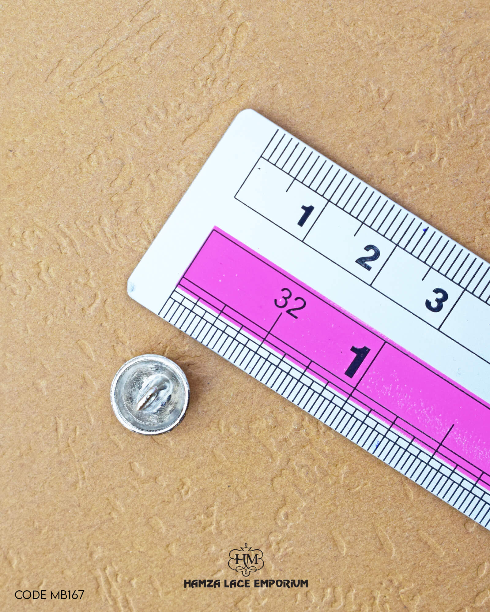 Size of the 'Silver Plane Metal Button MB167' is given with the help of a ruler