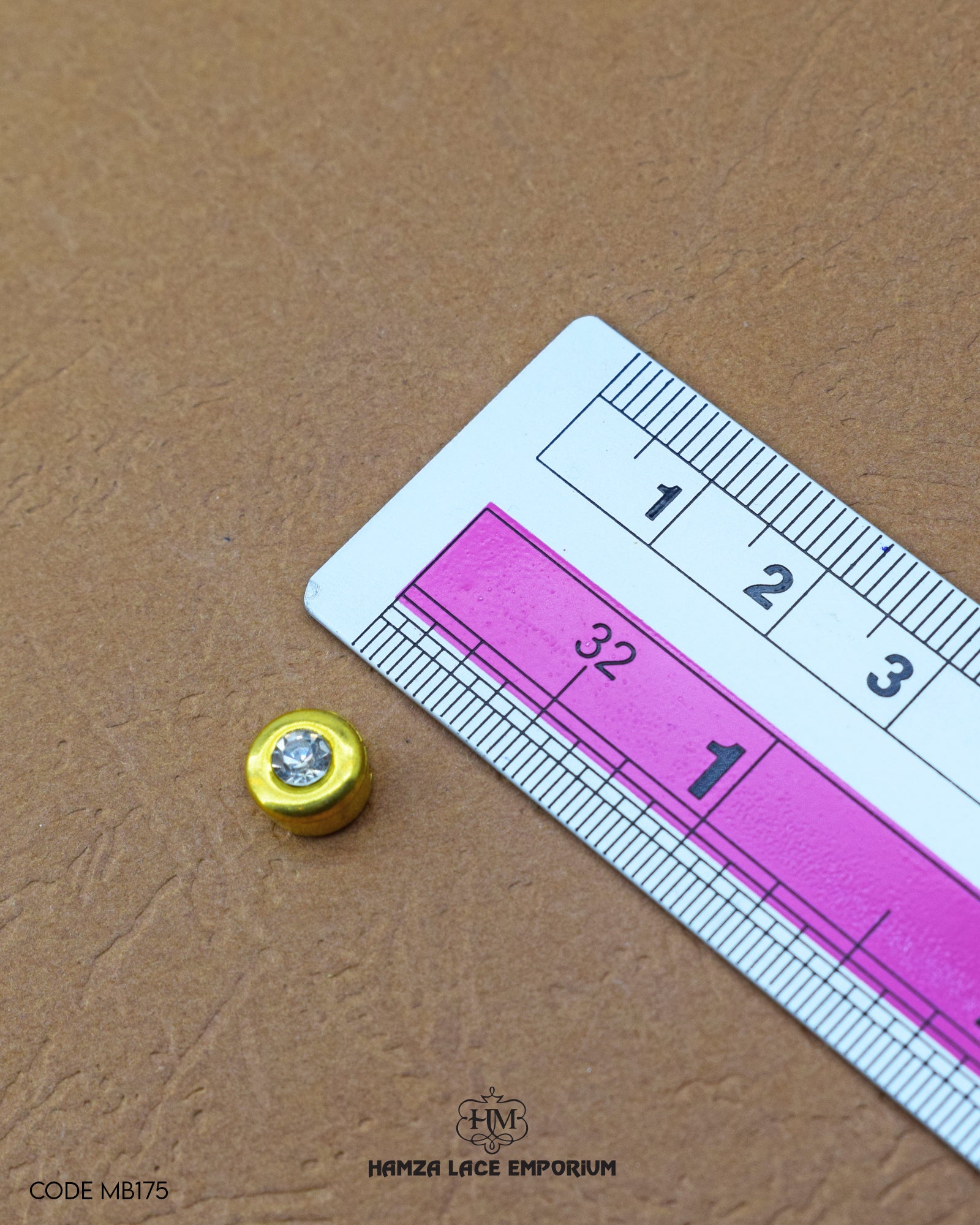 The size of the 'Metal Stone Button MB175' is measured using a ruler.