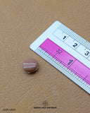 Size of the 'Brown Color Metal Button MB180' is given with the help of a ruler