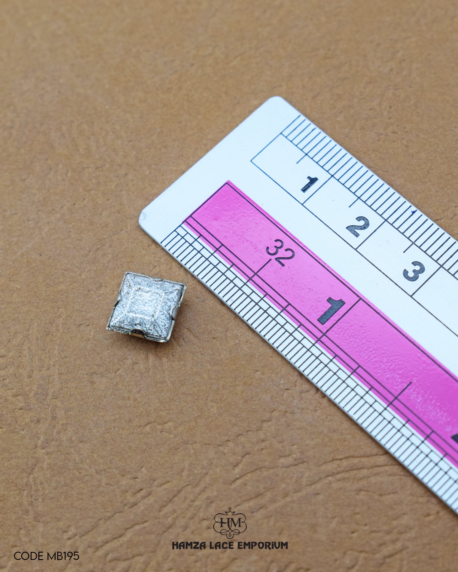 Size of the 'Metal Button MB195' is given with the help of a ruler