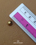 The size of the 'Golden Metal Button MB223' is measured using a ruler