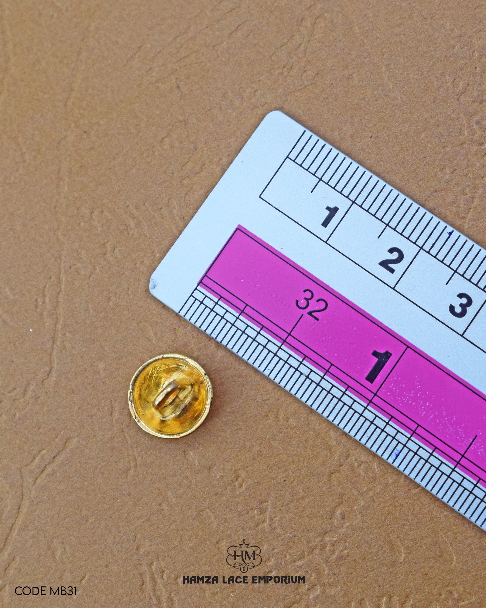 The size of the 'Golden Metal Button MB31' is measured using a ruler