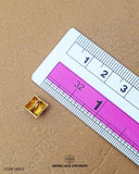 The size of the 'Golden Metal Button MB513' is measured using a ruler.