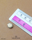 The size of the 'Metal Button MB562' is measured using a ruler.