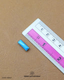 The size of the 'Hanging Metal Button MB565' is measured using a ruler.
