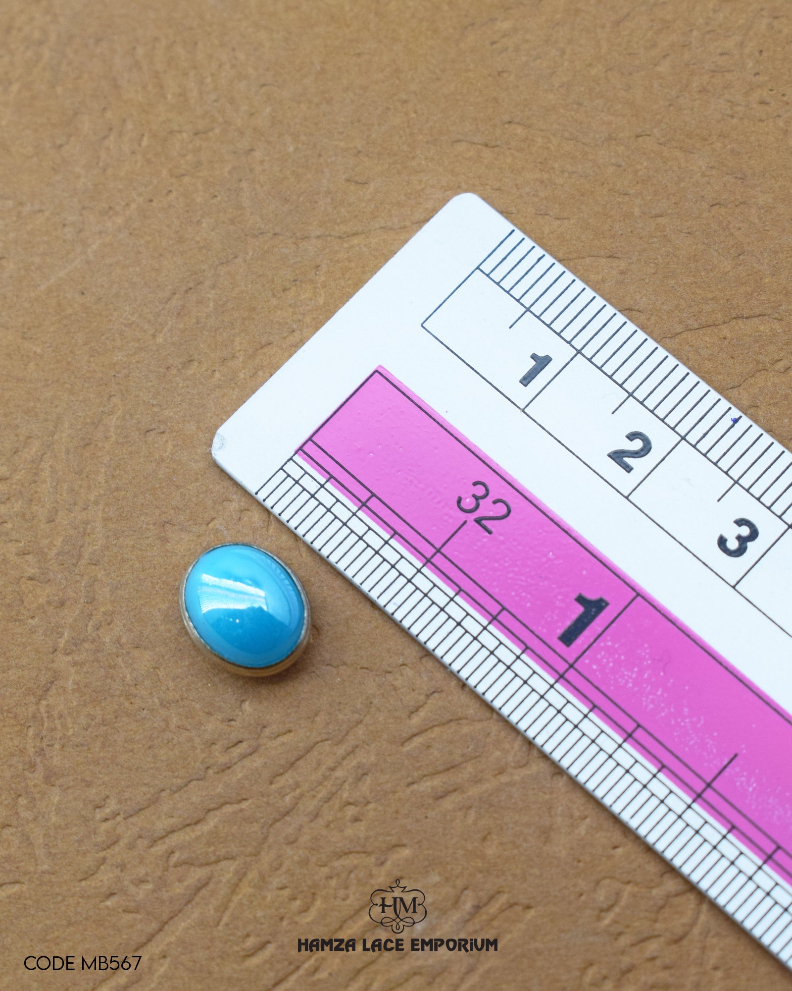 Size of the 'Metal Button MB567' is given with the help of a ruler
