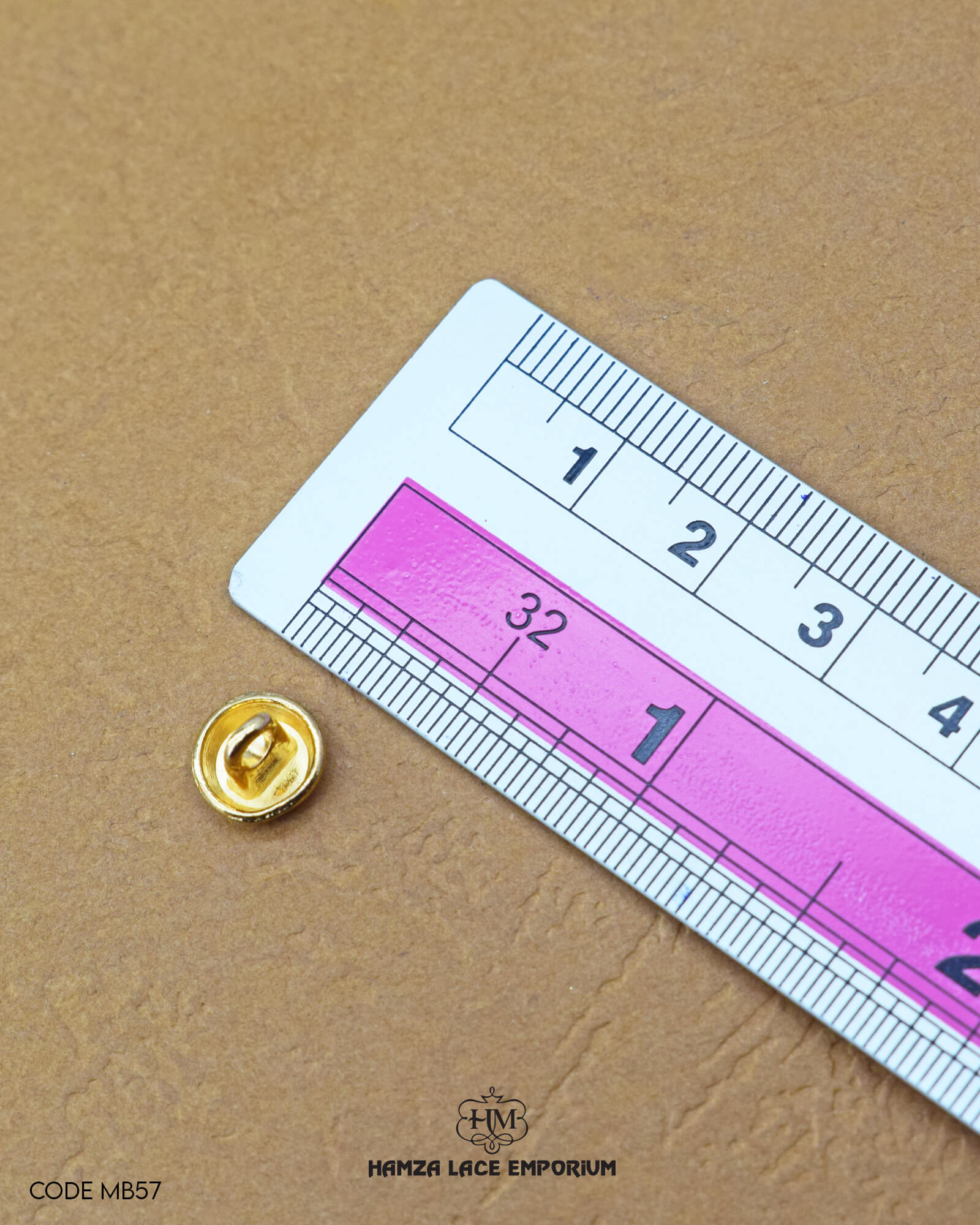 The size of the 'Metal Suiting Button MB57' is measured by using a ruler
