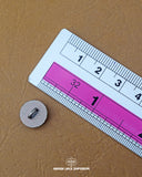 The size of the 'Brown Metal Button MB593' is measured using a ruler.