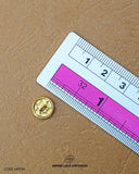 The size of the 'Black And White Metal Button MB594' is measured by using a ruler